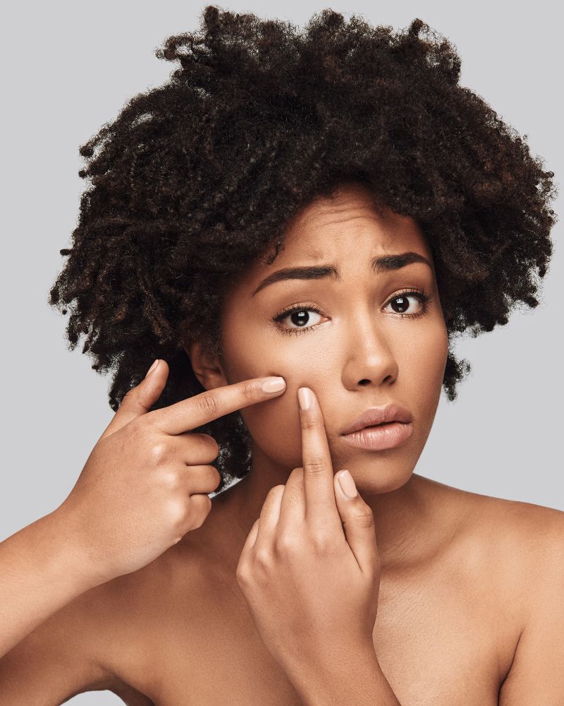 Woman touching her cheek